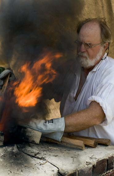 Gunsmith George Suiter mans the furnace at the second pour.