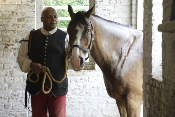 Interpreter James Ingram portrays a groomsman in the stable.