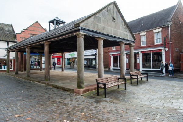 Market House, Market Drayton, Shropshire, England, 1824. This gabled, open-sided market house illustrates a relatively refined but small market structure, treated as a temple. Note how the center pair of columns in the gable end are more widely spaced than the others, suggesting that the principal axis of circulation for shoppers was down the center of the building, with market stalls on either side. This is the arrangement adopted for the Williamsburg Market House (photo: Photograph by Jeffrey E. Klee, CWF).