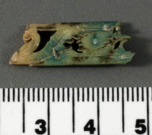 Fan blade fragment with copper rivet. Scale iin centimeters. 