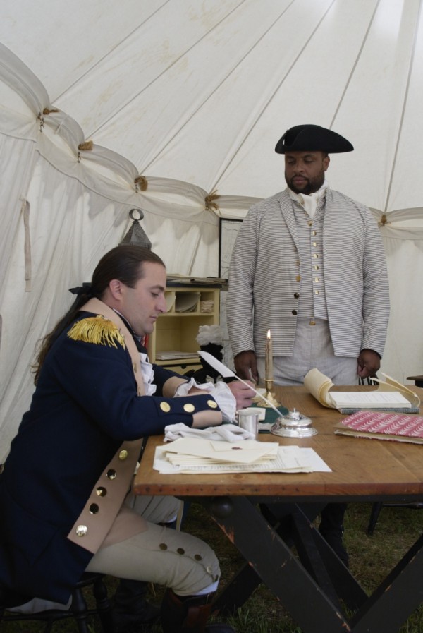 James Armistead, portrayed by Rex Ellis, confers with the Marquis de Lafayette, played by Mark Schneider.