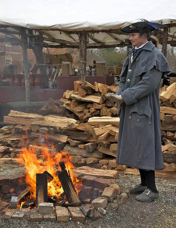 Liam Ingles, interpreter warming by the fire