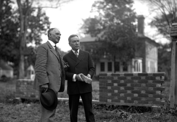 W.A.R. Goodwin and John D. Rockefeller, Jr. stand in back of the George Wythe House prior to the Williamsburg's restoration.