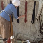 Painting the linen skeins with red paint (photo: K. Moffitt)