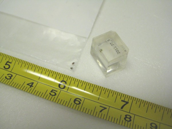 Unmounted paint samples in a plastic baggie (left), paint sample mounted in resin cube (right). 