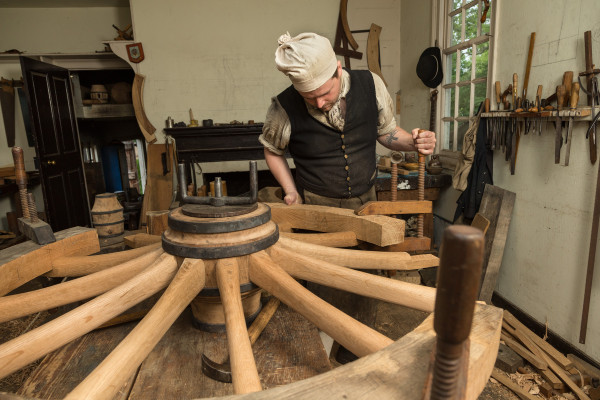 Andy De Lisle at the Wheelwright Shop working on a French cannon wheel being made for The Braintree Historical Society in Braintree, Massachusetts.  He’s putting the felloes on. Shot for Ben Swenson's Internet feature.  MODEL RELEASED