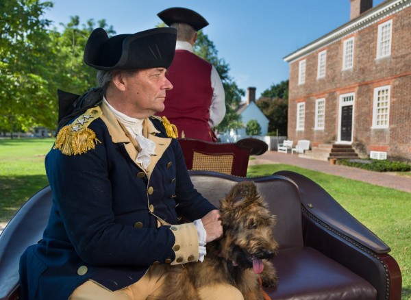 Ron Carnegie rides in a carriage with Liberty