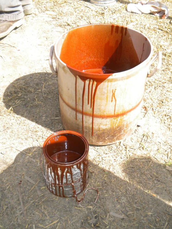 Warm tar paint pigmented with red ochre