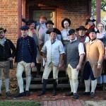 Historic Trades staff model their new leather breeches, and one leather stay