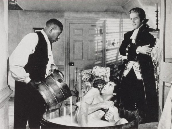 Cary Grant as Matt Howard reluctantly gets a bath as Richard Carlson as Thomas Jefferson looks on, in a scene from The Howards of Virginia 1940.