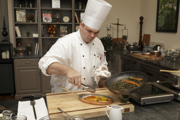 Chef Scott Watson cooking bourbon-glazed carrots in the Taste Studio