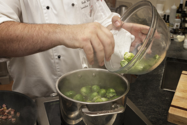 Chef Scott Watson cooking Brussels Sprouts in Taste Studio