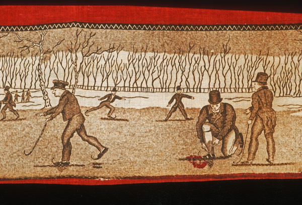 A detail in a handkerchief shows skaters on the ice