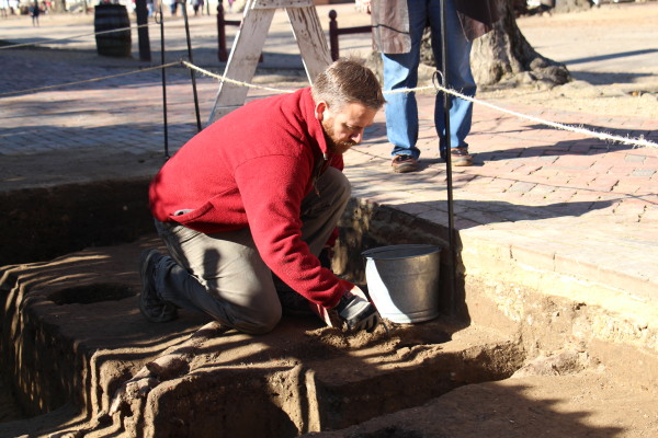 Archaeologist Mark Kostro excavates the site of the James Slate tenement on Duke of Gloucester St. Dec . 2015