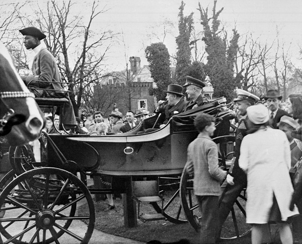 General Dwight Eisenhower and Winston Churchill ride down Duke of Gloucester Street during their visit to Colonial Williamsburg on March 8, 1946. Copy negative from 1953.