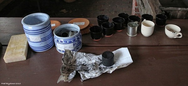 Shoemaker Rob Welch mixes a batch of black ball at Anderson's Blacksmith Shop.