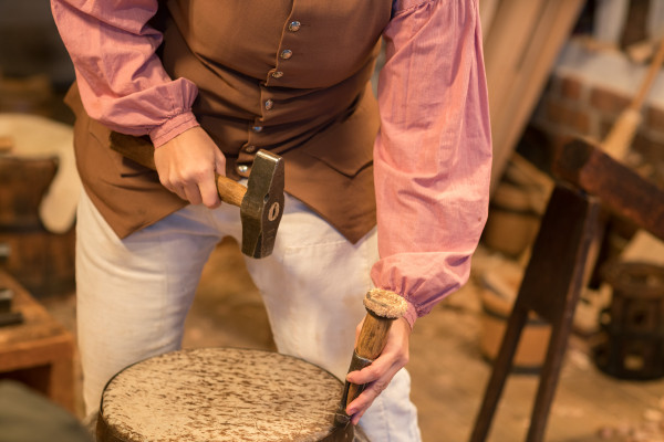 Cooper Ramona Vogel drives the ring to hold the skin on the African drum.