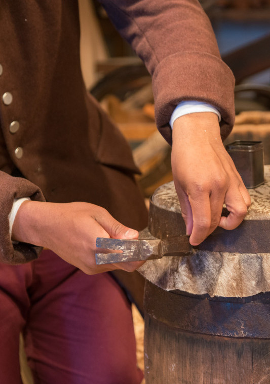 Marvin Greer and Ramona Vogel work on an African Drum for use in African American interpretive program