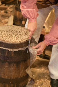 Cooper Ramona Vogel trims the extra skin from the African drum.