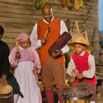 Interpreters play music at Great Hopes. Plantation