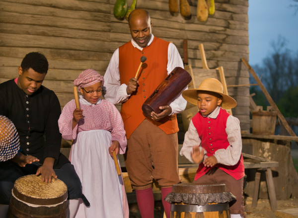 Interpreters play music at Great Hopes. Plantation 