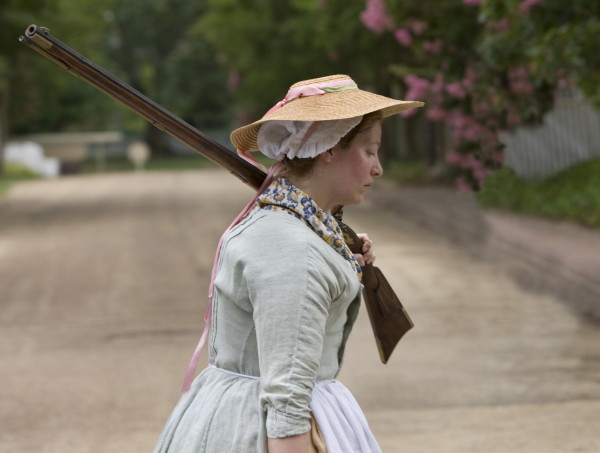 A camp follower carrying a firearm.