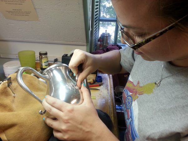 Meredith engraving a pitcher