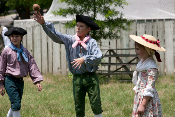 Kids playing Trap Ball