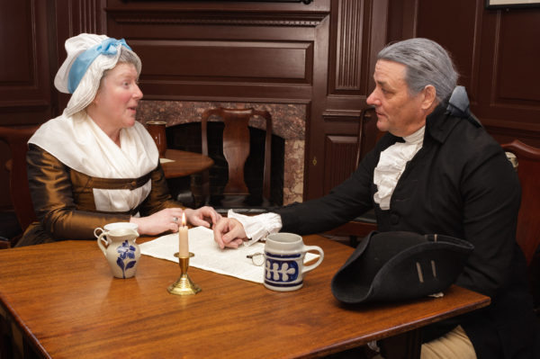 Martha and George Washington discuss American unity in King's Arms Tavern