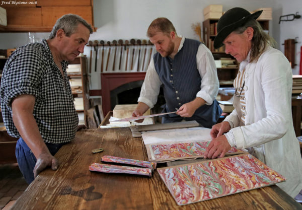 Blacksmith Steve Mankowski, Bookbinder Don Mason, and Military Artificer Jay Howlett