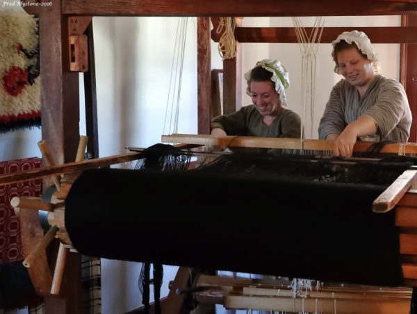 Working on a horse blanket on the countermarch loom at Weaver