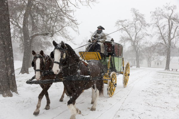 Dan Hard driving the Carter Coach in the falling snow.