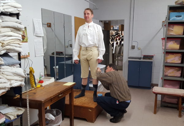 Tom Hammond fits Joe Ziarko for a costume as George Mason