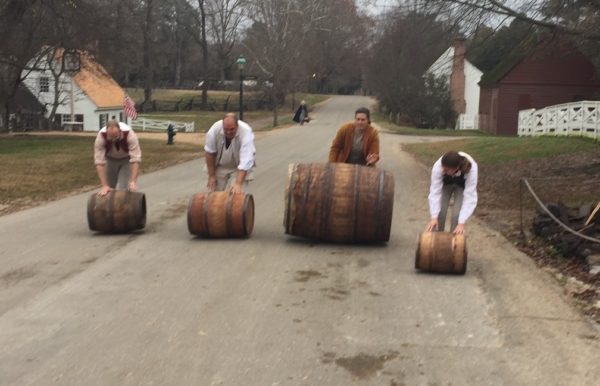 Coopers roll barrels down the street