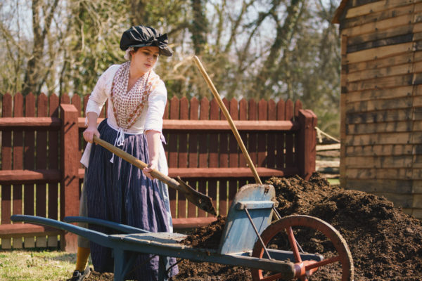 Shoveling manure at the Randolph House