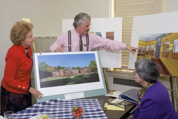 Abby O'Neill, architect Frank McGuire, and project manager Beatrix Rumford confer on the John D. Rockefeller, Jr., Library plans.